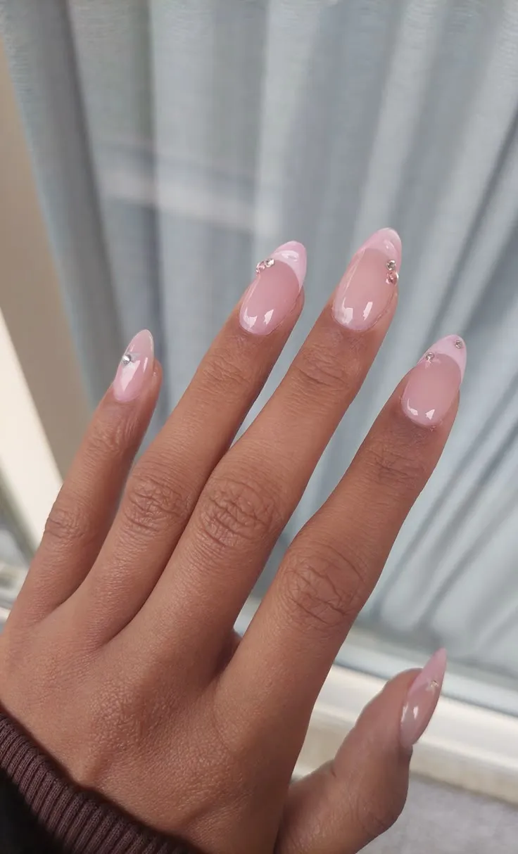 Light pink almond nails with gems