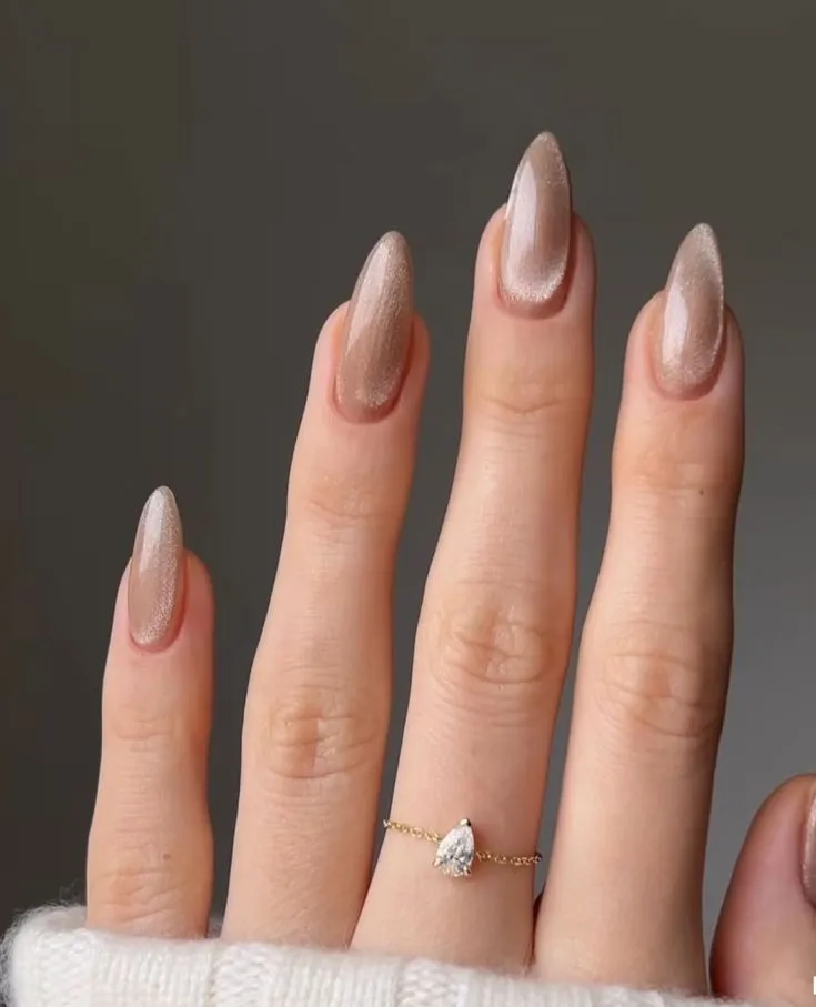 Shimmering Almond Nails with Metallic Glitter 2025