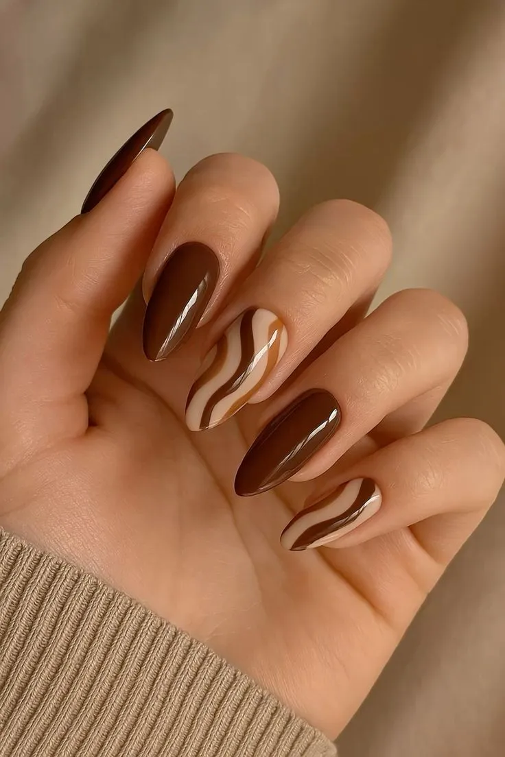 Burnt orange and brown swirl nails autumn nails
