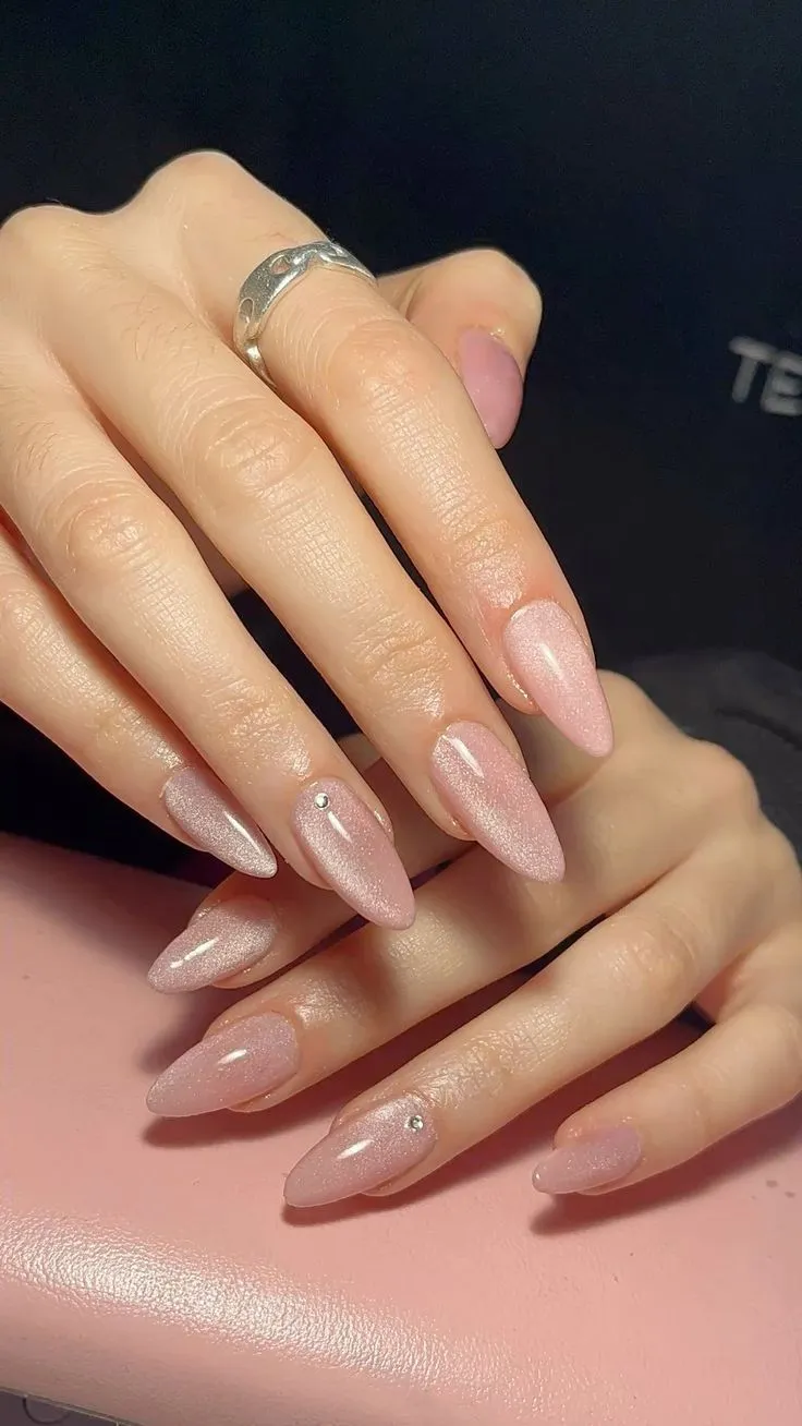 Light Pink Cat Eye Nails Design with Gems on Almond Nails