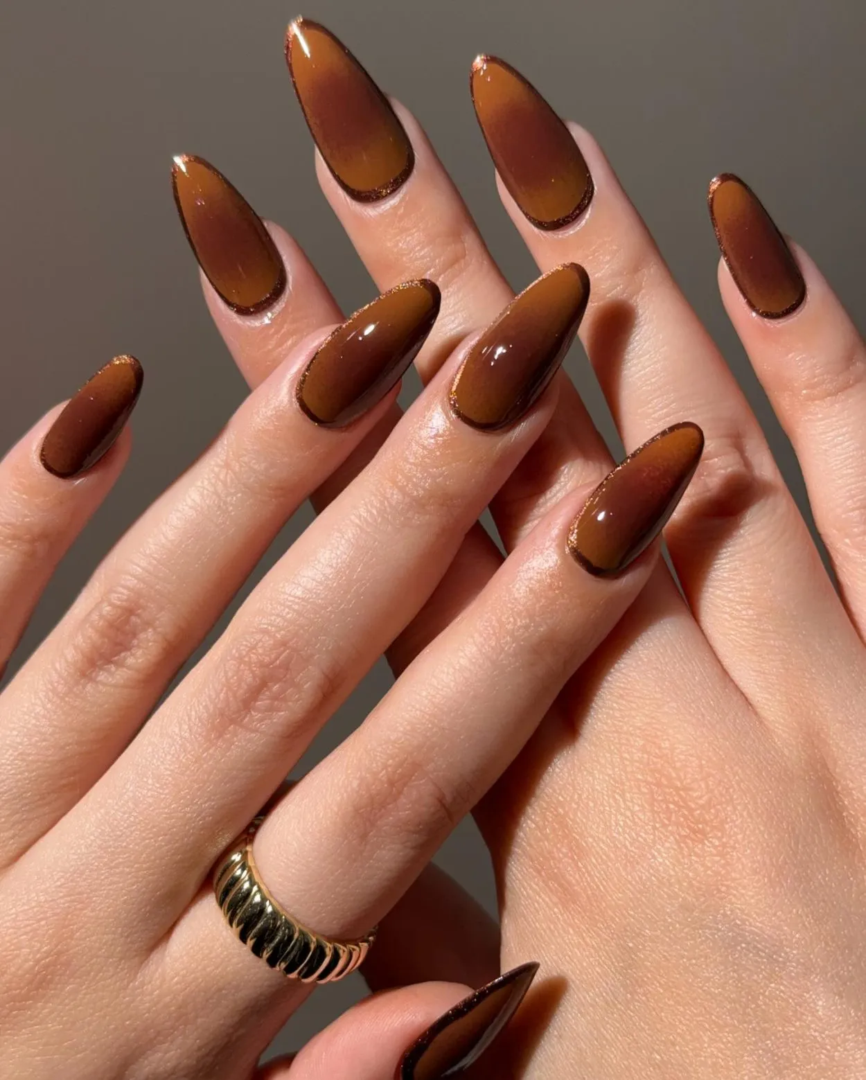 Brown and auburn aura nails with glitter outline brown nails